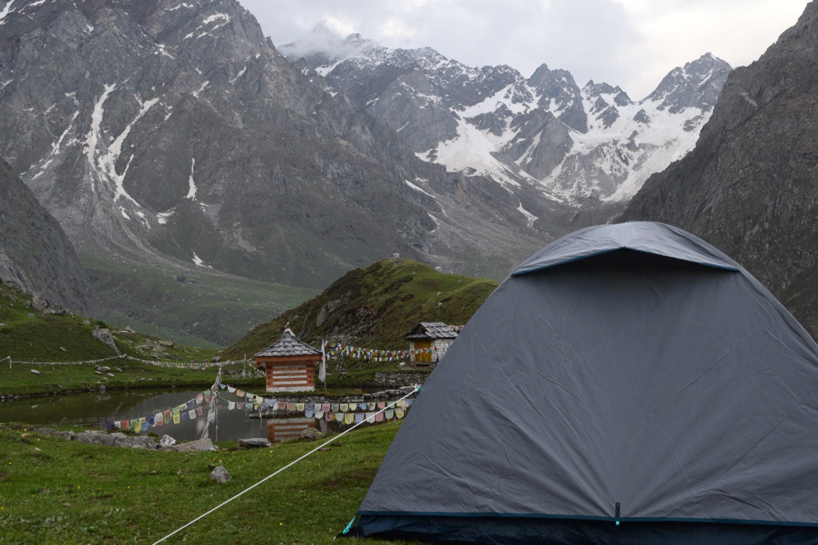 Camping at Yulla Kanda with the Krishna temple and snow-capped Himalayan peaks